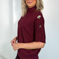 Carmen Short Sleeve Jumper with Gold Buttons Over the Shoulder - Burgundy